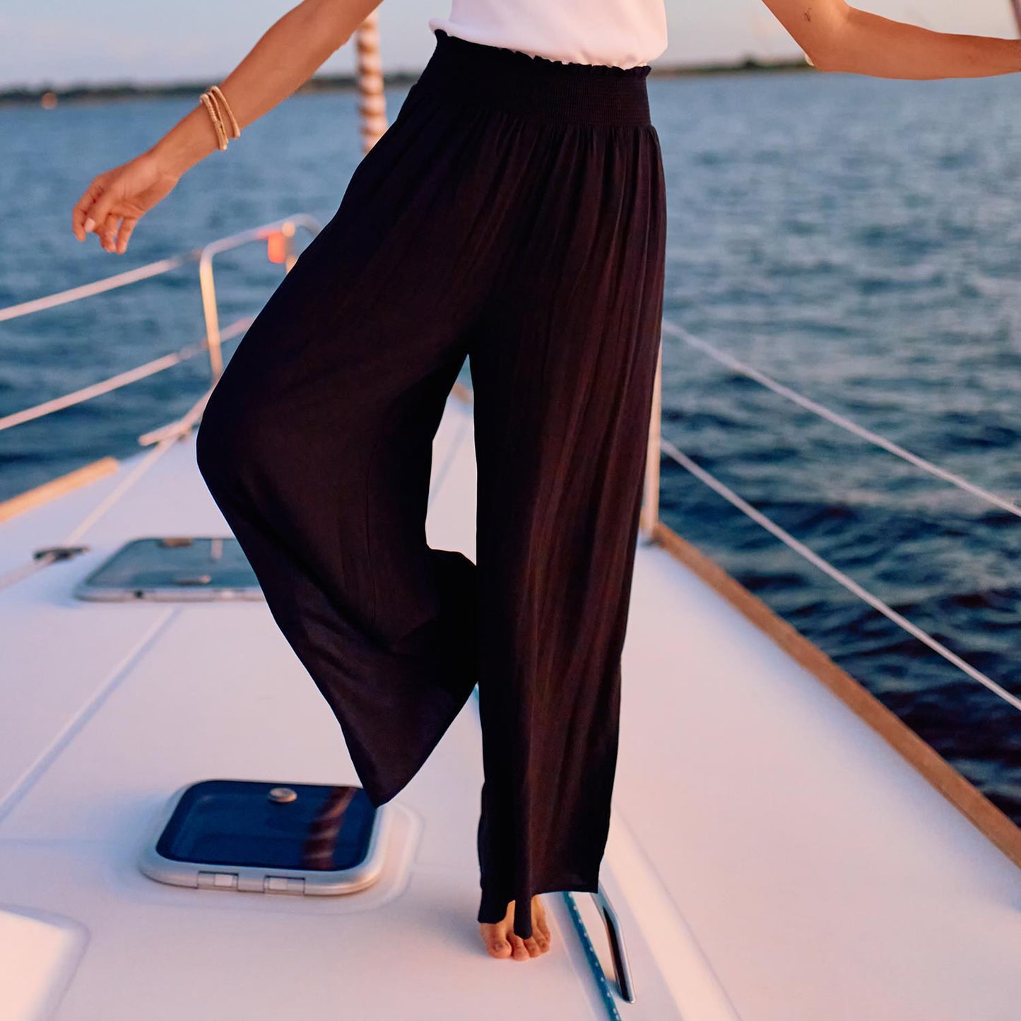 Krista Pants feature a smocked waist for comfort and style. Available sizes: XS, S, M, L, XL.