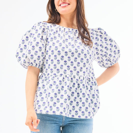 Nina Floral Foulard Navy Top: white blouse with blue floral pattern, puff sleeves. Available in sizes XS–XL.