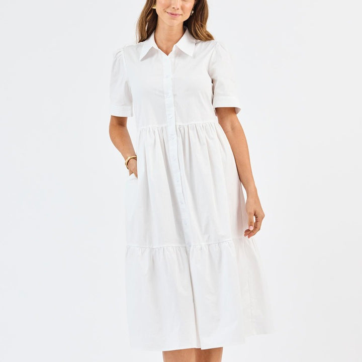 Jema White Dress: breathable, collared, short-sleeve, button-down midi with tiered skirt and pockets. Available in sizes XS–XL.