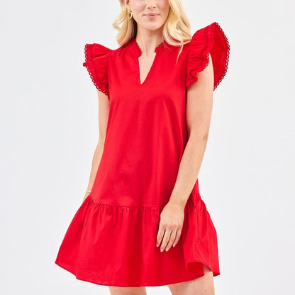 Sierra Red Dress: short, cotton, flutter sleeves, V-neckline. Available in sizes XS–XL.