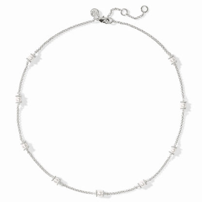 Small white shell pearl clusters on silver-plated adjustable chain; round charm at clasp. Available in multiple sizes.