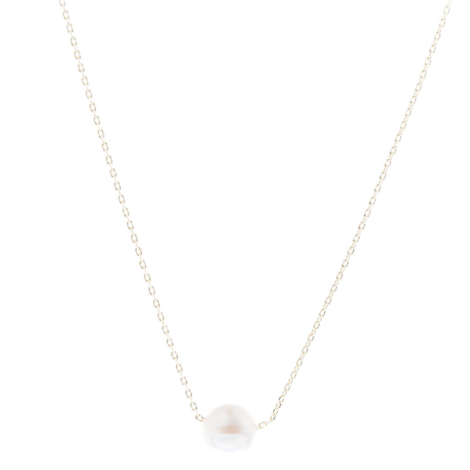 The Carly Gold Luxe Necklace features a minimalist 18K gold-plated chain with a white pearl charm. Sizes available: 16", 18".