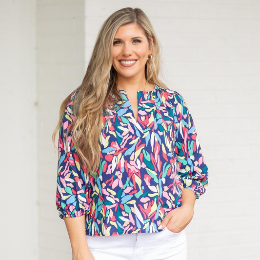 The Wishing Pool Navy Simone Top is available in small, medium, large, and extra-large sizes.