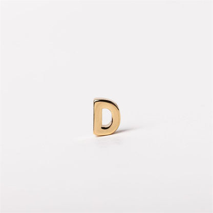 Gold-colored metal letter "D" charm, small size; available in sizes S, M, and L. Customizable for Luxe Charm Necklace Bar.