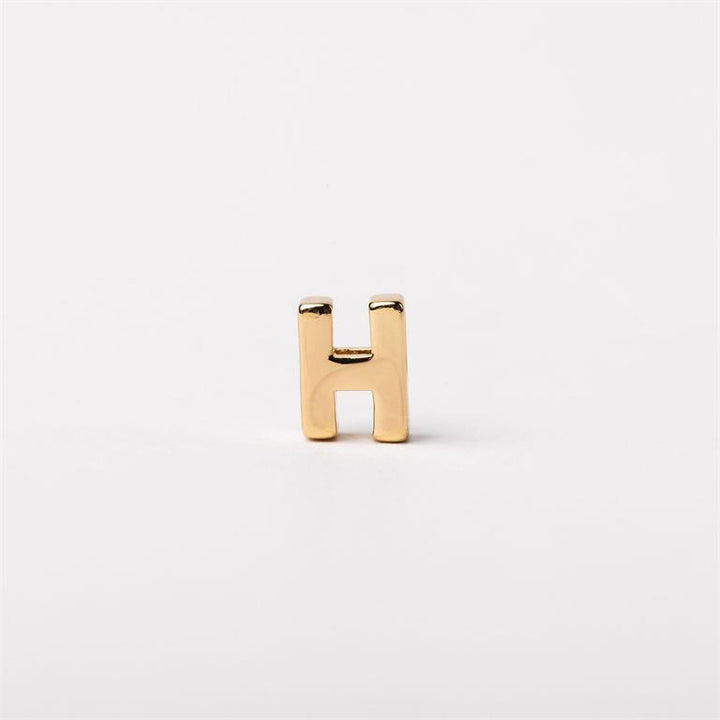 Small shiny gold letter "H" charm, available in multiple sizes, for Luxe Charm Necklace Bar.