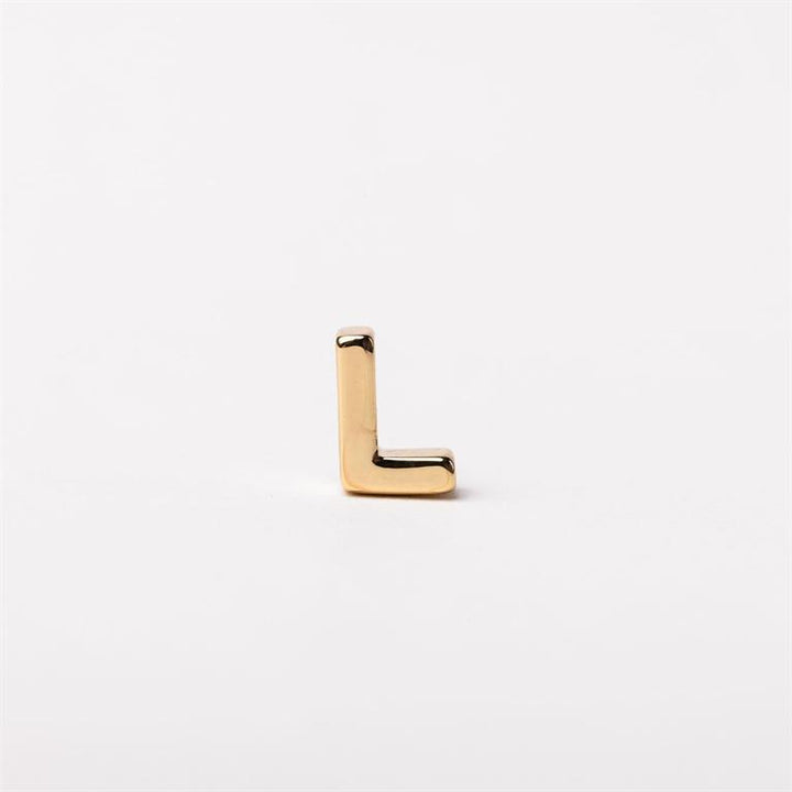 The Luxe Charm Necklace Bar: small, shiny gold "L"-shaped charm. Available sizes: mini, medium, large.