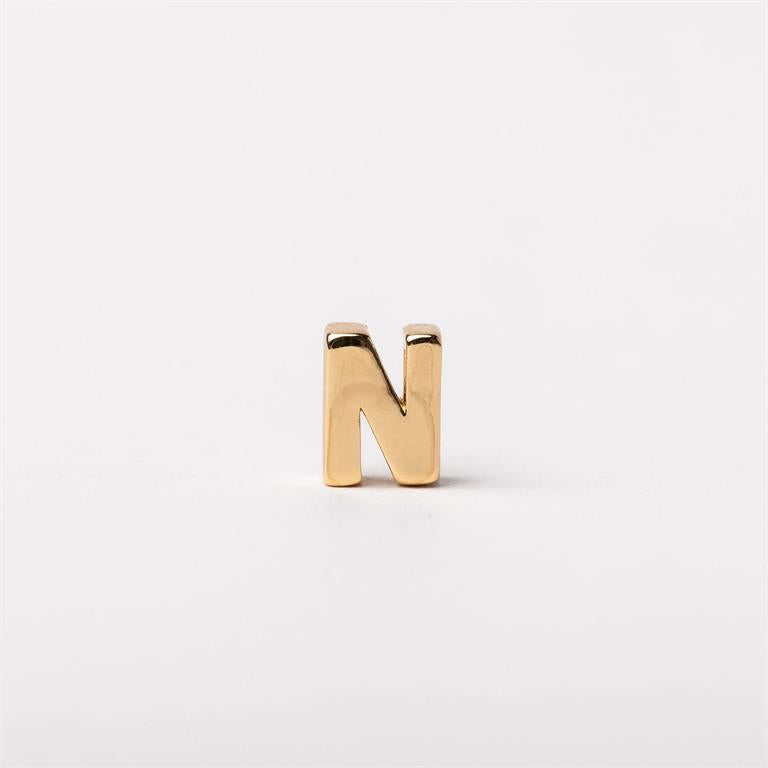 Shiny gold-colored metallic letter "N" charm for necklaces, available in multiple sizes, customizable accent.