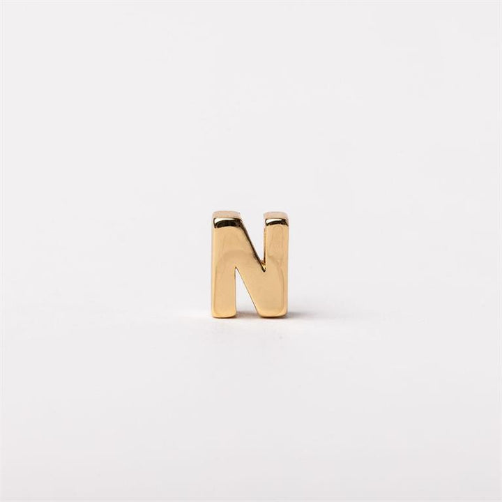 Shiny gold-colored metallic letter "N" charm for necklaces, available in multiple sizes, customizable accent.