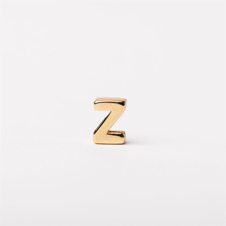 Small gold-colored metallic letter "Z" charm, available in multiple sizes.