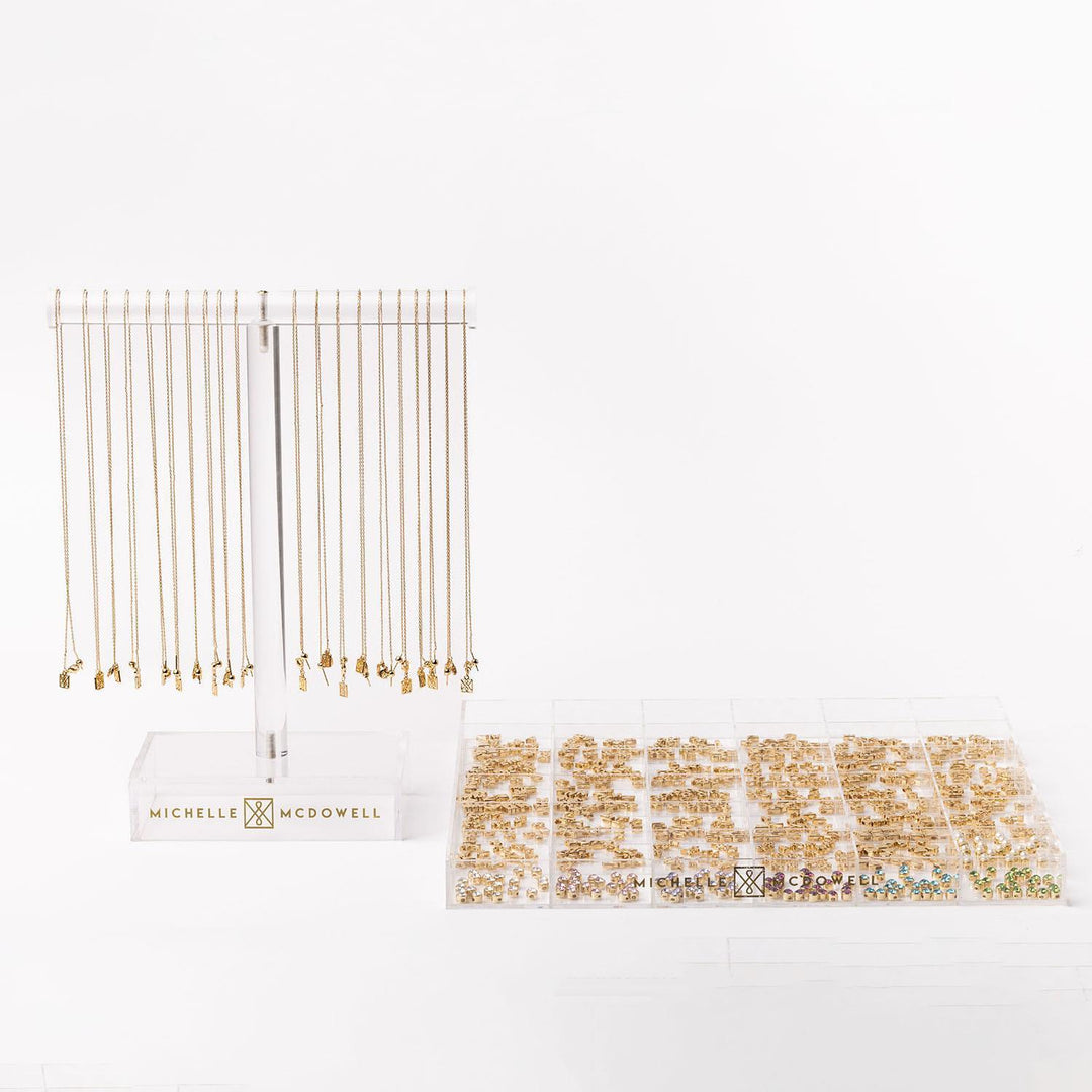 Luxe Charm Necklace Bar with gold chain link necklaces on "Michelle McDowell" stand; available in 16", 18", and 20" lengths.