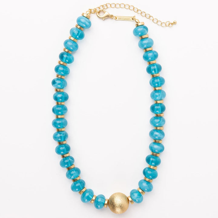 Kylie Necklace: turquoise blue round beads, gold accents, central bead, gold spacers, gold clasp. Sizes: S, M, L.