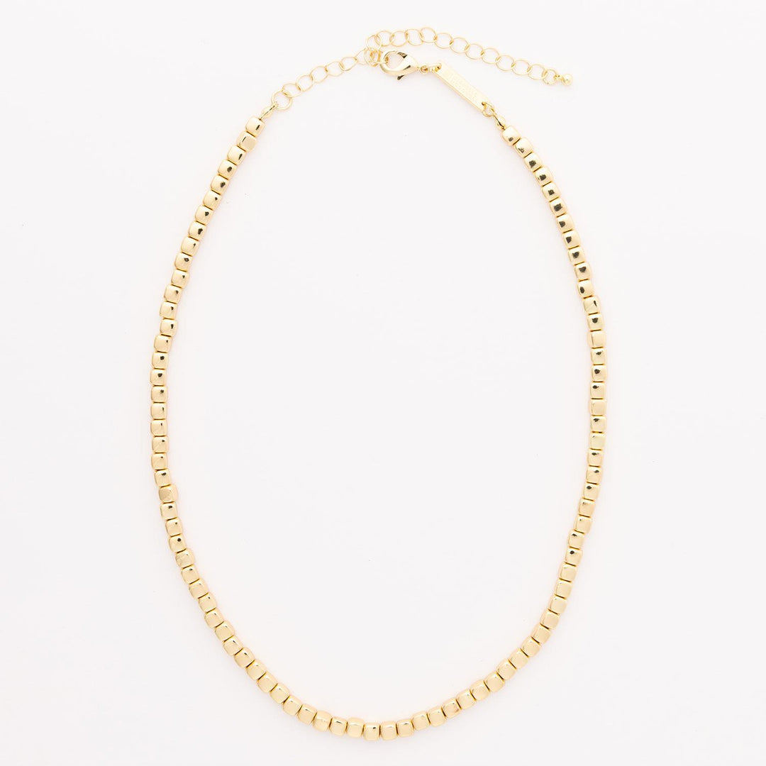 Delicate gold chain with small square beads and adjustable clasp. Available in 16", 18", and 20" lengths.