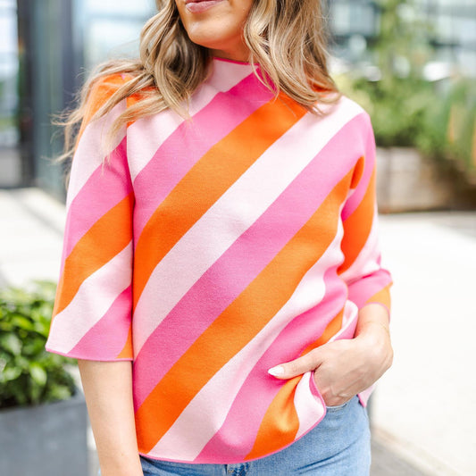 Phoebe Pink & Orange Stripe Sweater: Diagonal stripes in pink, orange, and white. Sizes available: S, M, L.