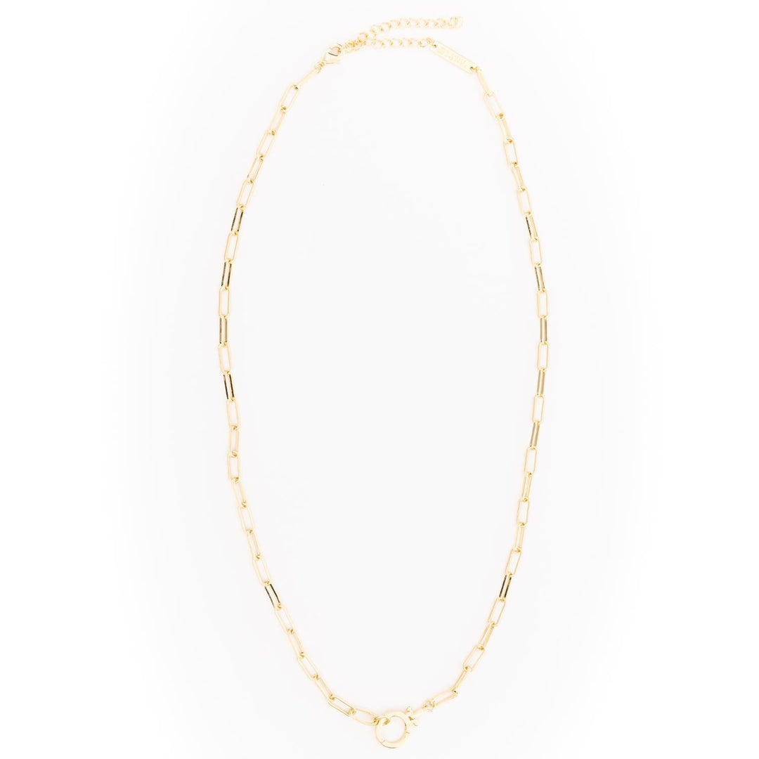 Thea Charm Bar is an 18k gold-plated, hypoallergenic necklace with elongated rectangular links and an adjustable clasp, designed for customizable charms. Available in multiple lengths.