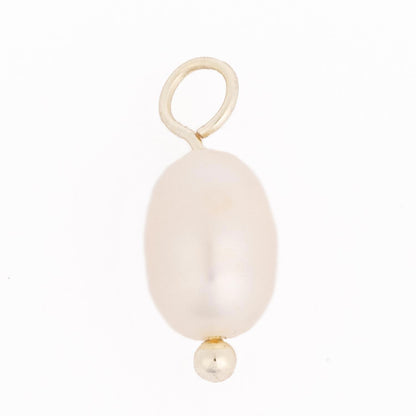 Thea Charm Bar: single white oval pearl pendant with a small gold bead at the bottom and gold loop at the top, on an 18k gold-plated chain. Hypoallergenic. Available in multiple sizes.