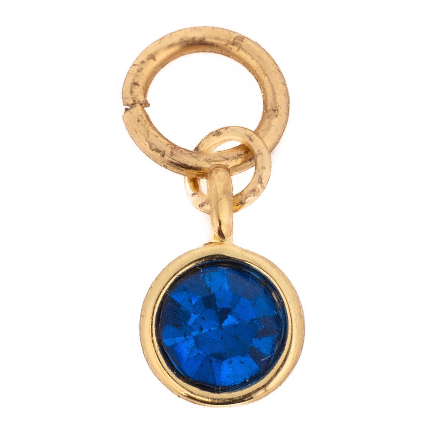 Hypoallergenic, customizable necklace with a small gold charm featuring a circular blue gemstone in a gold bezel and jump ring; available in multiple sizes.