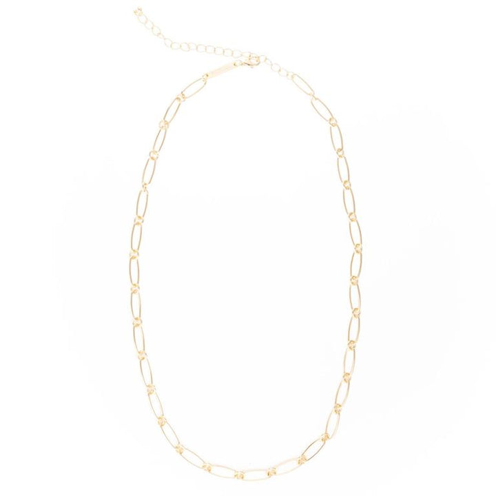 The Luxe Clip-On Charm Necklace Bar is an 18K gold plated necklace with elongated oval links and an adjustable clasp. Available in various lengths for customization with clip-on charms.