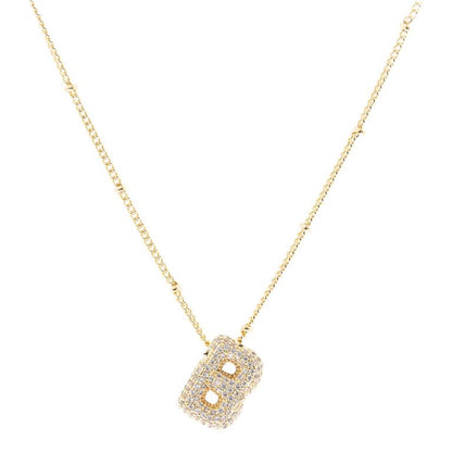 The Chloe Necklace is an 18K gold-plated necklace with a "B" pendant adorned with diamonds. Available sizes: adjustable chain length.