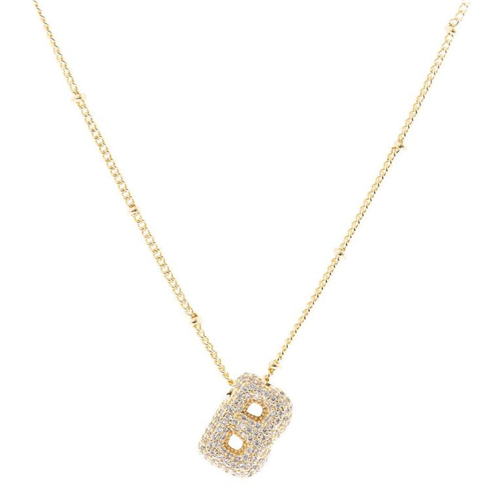 The Chloe Necklace is an 18K gold-plated necklace with a "B" pendant adorned with diamonds. Available sizes: adjustable chain length.