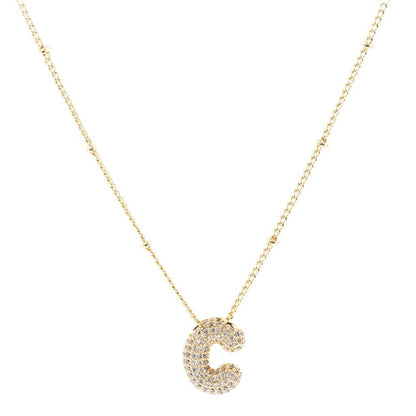 The Chloe Necklace showcases a "C" pendant adorned with sparkling stones on an 18K gold-plated chain. Available sizes: Adjustable length.