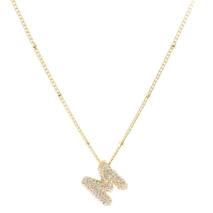 Chloe Necklace: 18K gold plated with diamond-encrusted initial "M" pendant. Available in standard chain lengths.