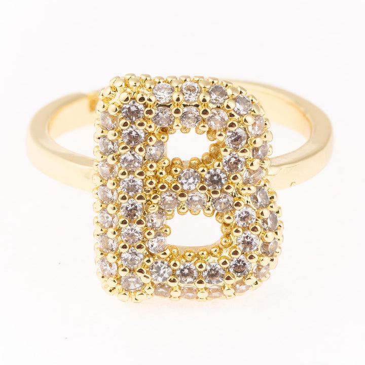 Gold plated initial ring with diamond-studded "B," hypoallergenic. Available in sizes 5-9. Perfect for daily wear.