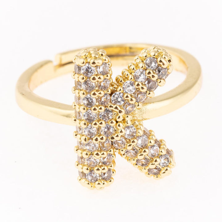 Gold-plated initial "K" ring with diamonds, hypoallergenic. Available sizes: 5–9.