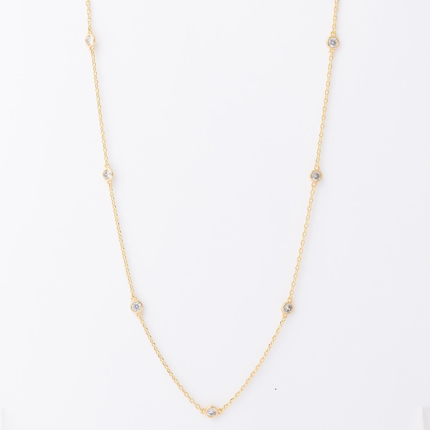 Gold necklace with evenly spaced small round gemstones on a fine chain. Available in 16", 18", and 20" lengths.