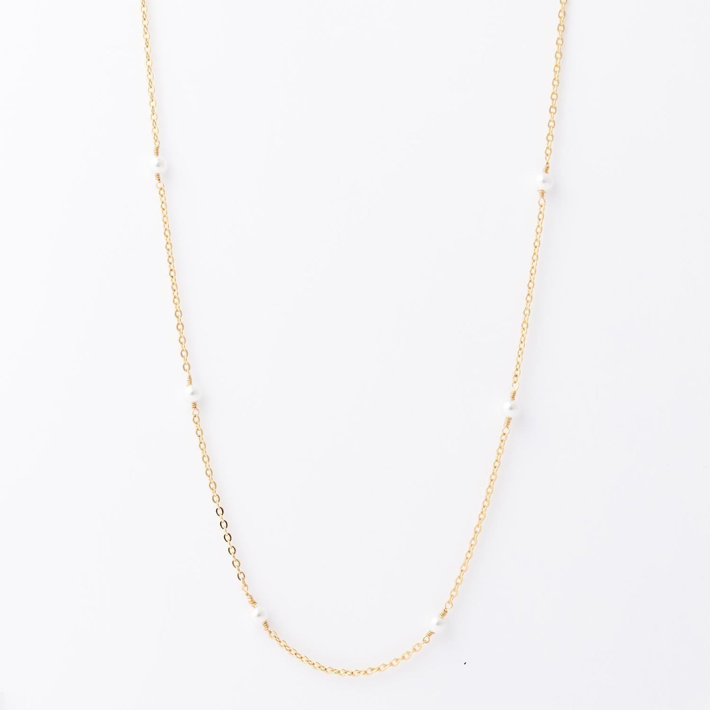 Lois Necklace: 18K gold-plated, features small, evenly spaced white pearls. Hypoallergenic. Available in 16", 18", and 20" lengths.