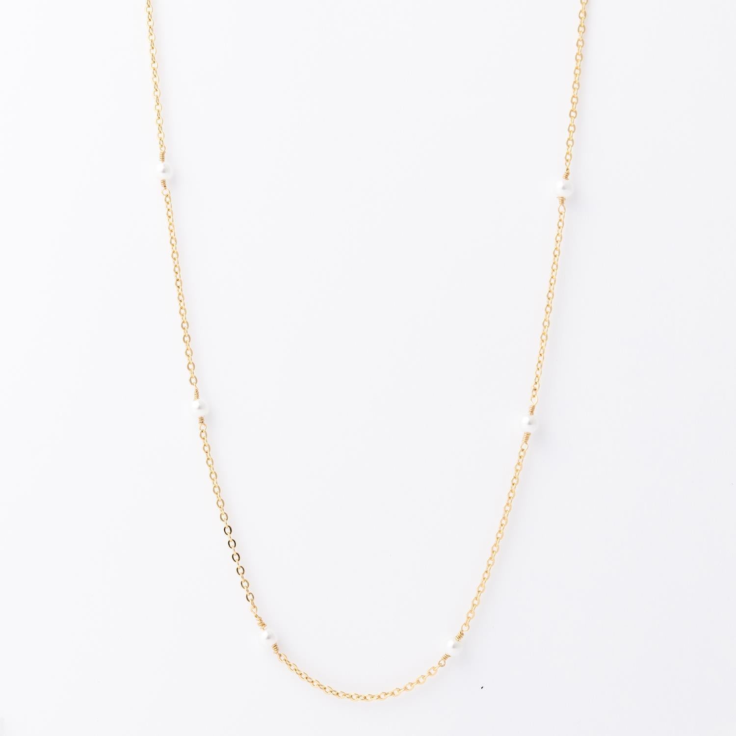 Lois Necklace: 18K gold-plated, features small, evenly spaced white pearls. Hypoallergenic. Available in 16", 18", and 20" lengths.
