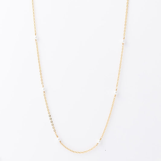 Lois Necklace: 18K gold-plated, features small, evenly spaced white pearls. Hypoallergenic. Available in 16", 18", and 20" lengths.