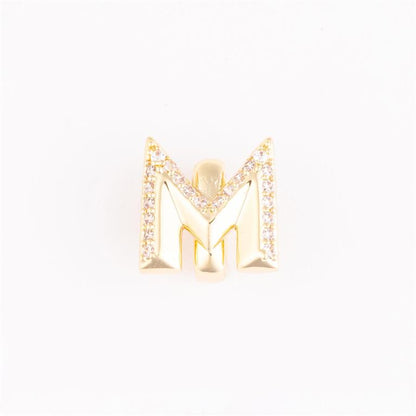 Gold letter "M" charm with clear stone accents on the edges; available in small and medium sizes.