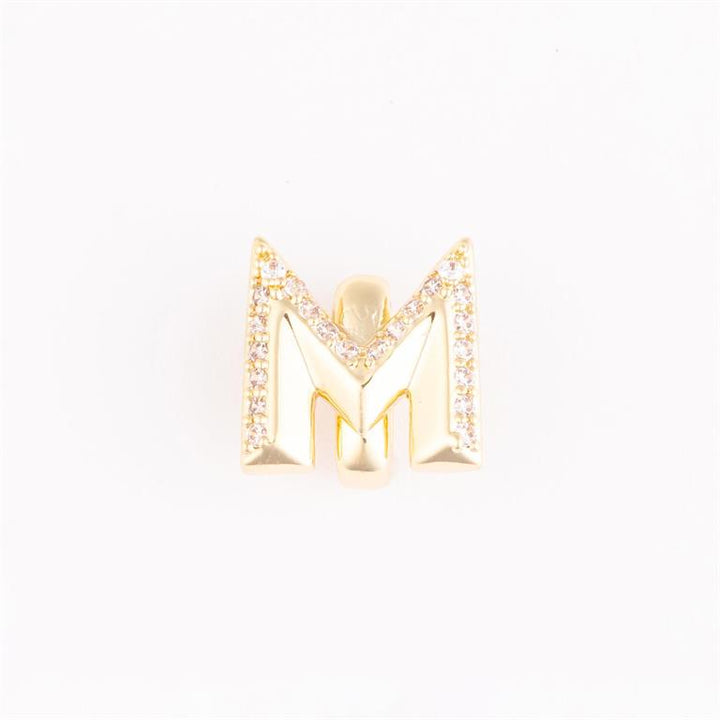Gold letter "M" charm with clear stone accents on the edges; available in small and medium sizes.
