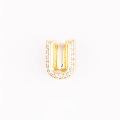 Gold "U"-shaped charm with outer gemstones for charm bracelets; available sizes: small, medium, large.