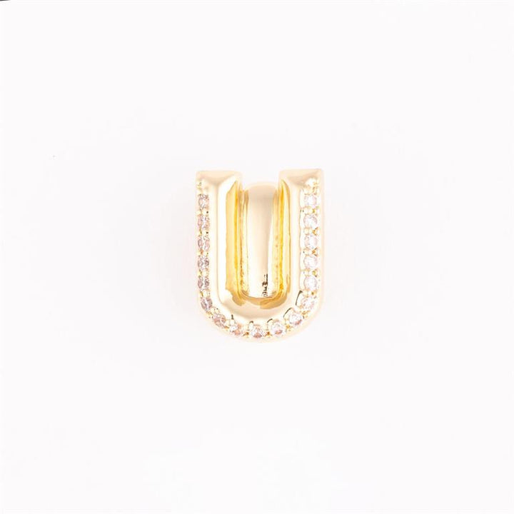Gold "U"-shaped charm with outer gemstones for charm bracelets; available sizes: small, medium, large.