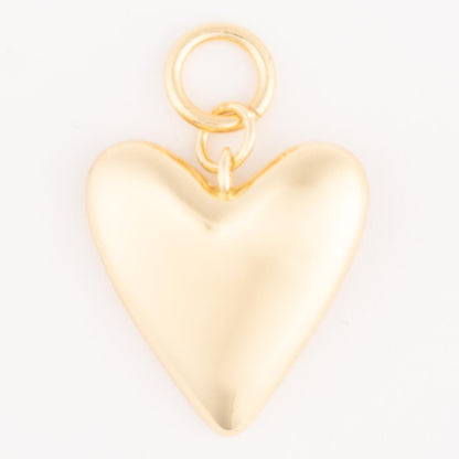 Shiny 18k gold-plated heart-shaped pendant with a small loop for attachment; hypoallergenic and customizable. Available in multiple sizes.