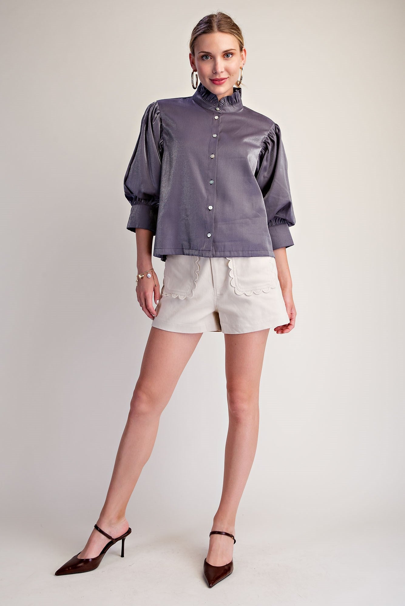 Silver Starlight Blouse with puff sleeves, subtle ruffle neckline, and metallic finish; available in sizes XS–XL.