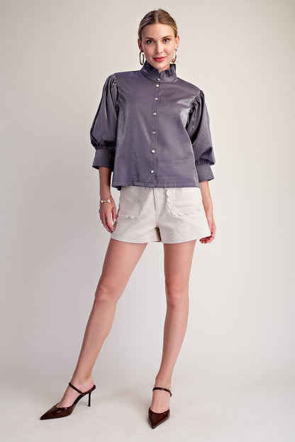 Silver Starlight Blouse with puff sleeves, subtle ruffle neckline, and metallic finish; available in sizes XS–XL.