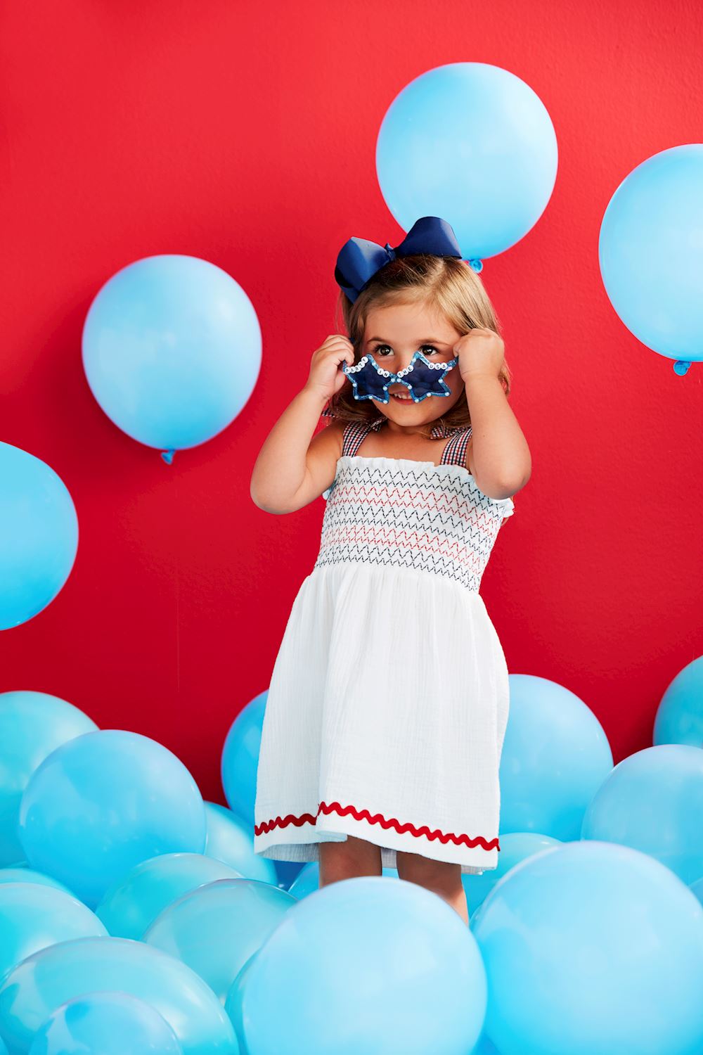 The White Smocked Gauze Toddler Dress is a charming outfit for young girls. Sizes available: 2T, 3T, 4T, and 5T.