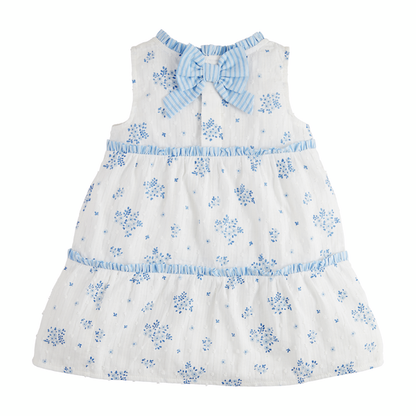 Blue Floral Tiered Toddler Dress: Sleeveless white cotton with blue floral patterns, ruffled trim, striped blue bow at back, tiered skirt. Sizes: 2T, 3T, 4T, 5T.