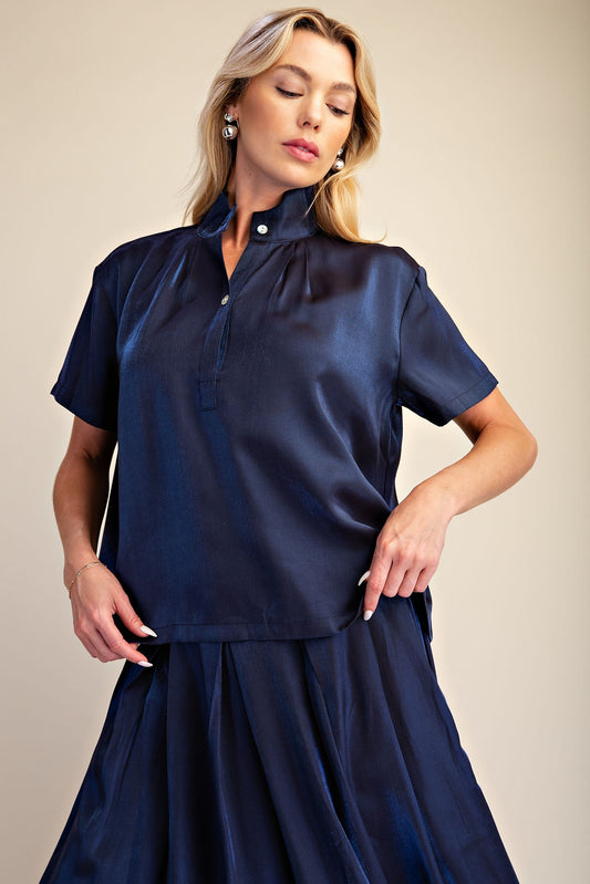 Midnight Shimmer Blouse: short-sleeve women's top in metallic navy with button detail, available in sizes XS-XL.