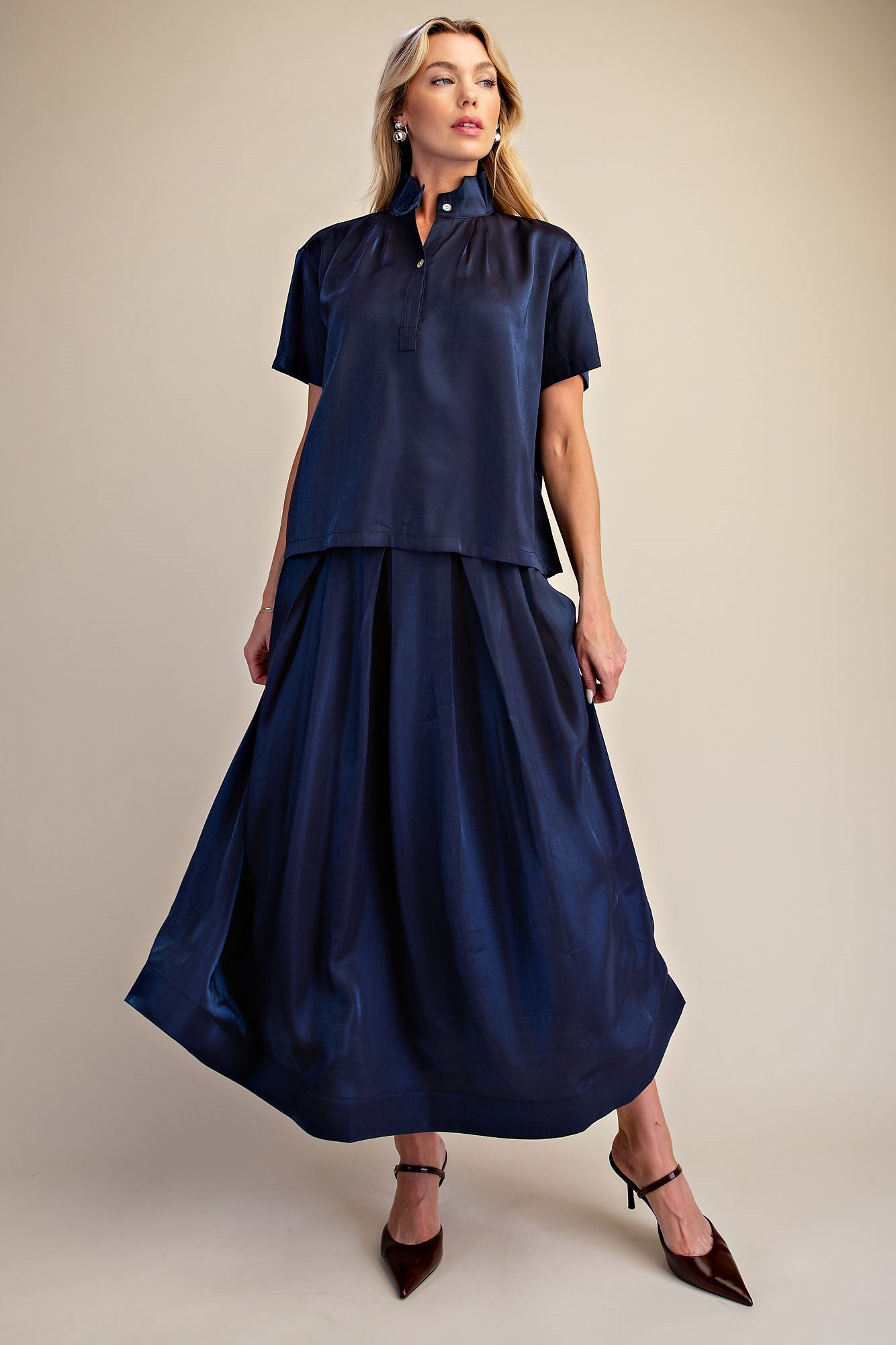 Midnight Shimmer Blouse: shiny metallic navy short-sleeve top, available in sizes XS–XL.