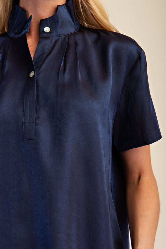 Midnight Shimmer Blouse: short-sleeve metallic navy top with mandarin collar and button placket. Available in sizes XS–XL.