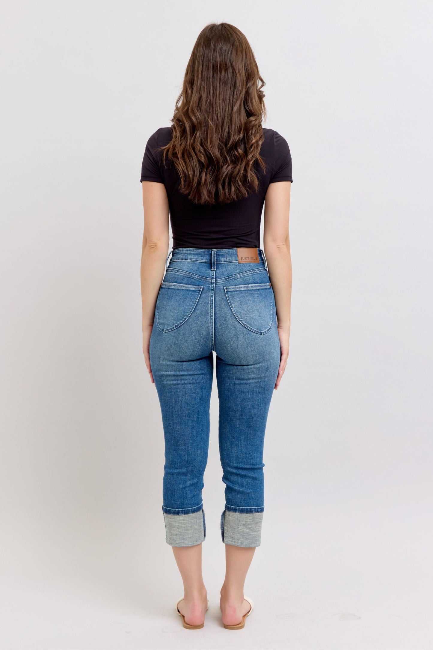 Judy Blue HW Tummy Control Back Shield Pkts & Cuff Capri jeans; available in sizes 0–22.