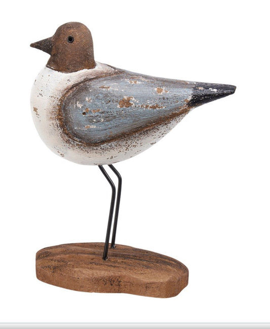 Rustic wood sandpiper decor with white, blue, and brown bird on a black metal base. Available in large size.