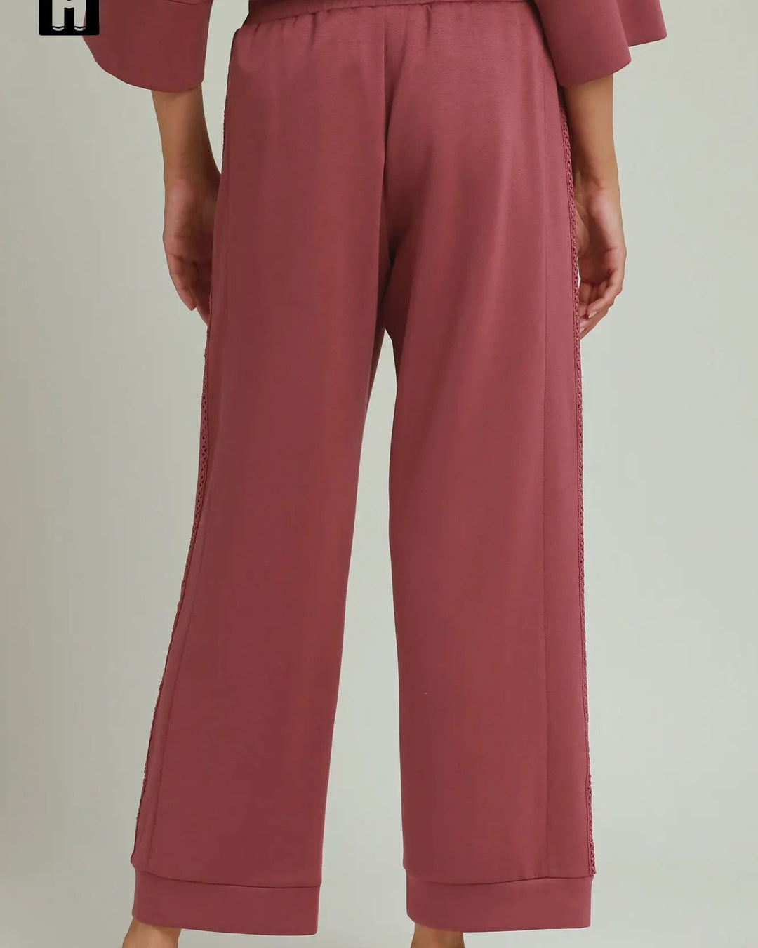 Loose-fitting, wide-legged marsala Butterfly Lace Straight Leg Pants with visible side seams and relaxed fit. Available in sizes XS-XL.