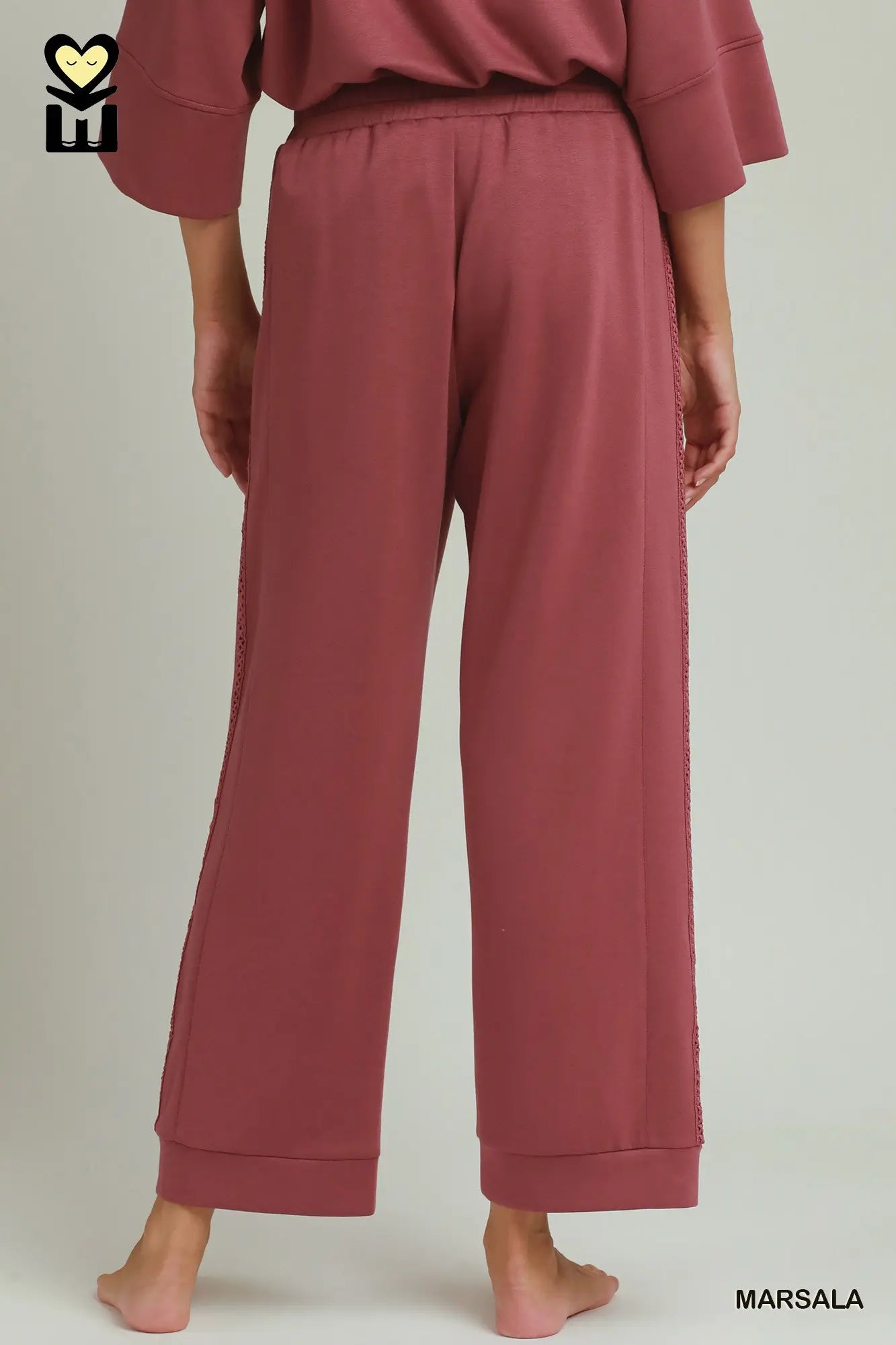Loose-fitting, wide-legged marsala Butterfly Lace Straight Leg Pants with visible side seams and relaxed fit. Available in sizes XS-XL.