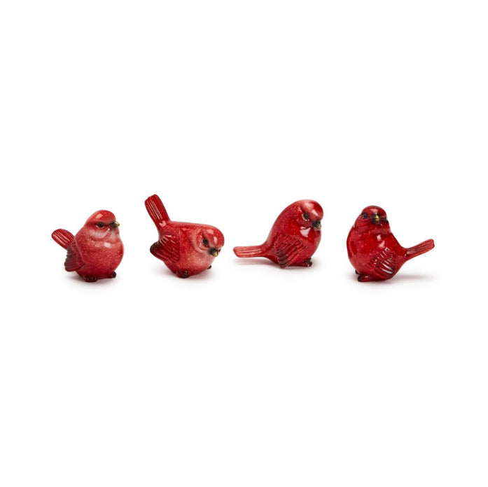 Four small hand-painted red cardinal figurines.