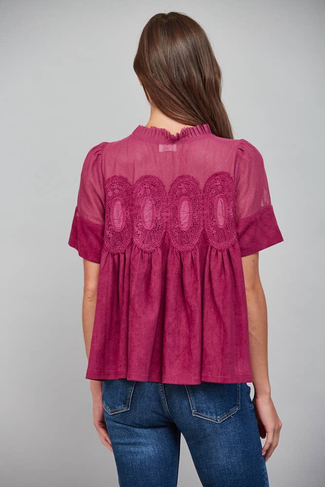 Teal blue short-sleeved top, size M, with sheer mesh upper panel, round lace applique, and faux suede body.