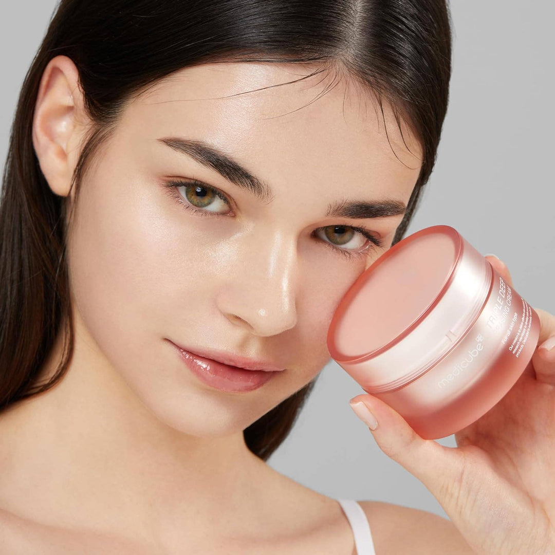 MEDICUBE Triple Collagen Cream in a pink jar; anti-aging formula. Available in 50ml and 100ml sizes.